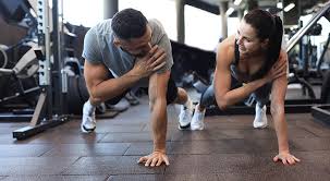 Toning Bingo Wings: Your Ultimate Guide to Sculpting Sleek Arms at the Gym 3 Fitness trainer demonstrating arm toning exercises Kenilworth